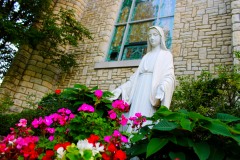 Mary and flowers by the chapel
